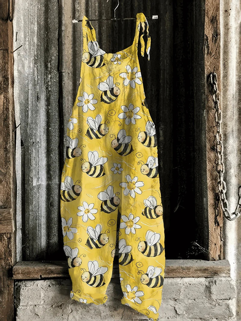 Lightweight artisanal jumpsuit in yellow cartoon bee & daisy print