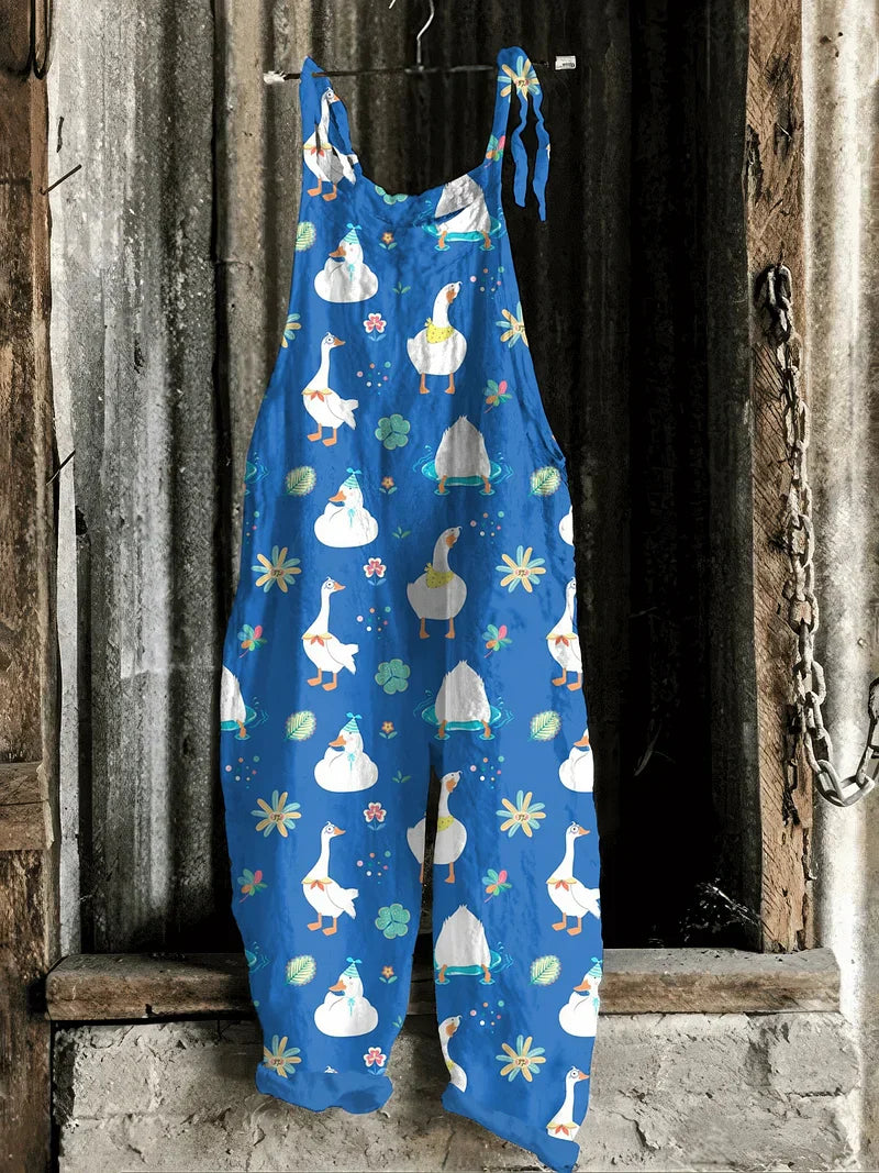 Lightweight artisanal jumpsuit in cobalt blue with playful goose & floral print