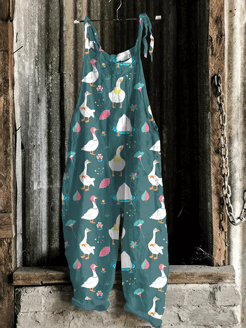 Lightweight artisanal jumpsuit in teal with playful goose & floral print