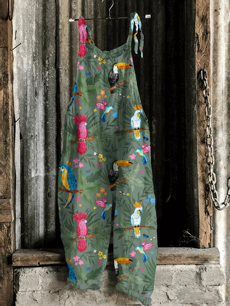 Lightweight artisanal jumpsuit in jungle green with tropical parrot & toucan print