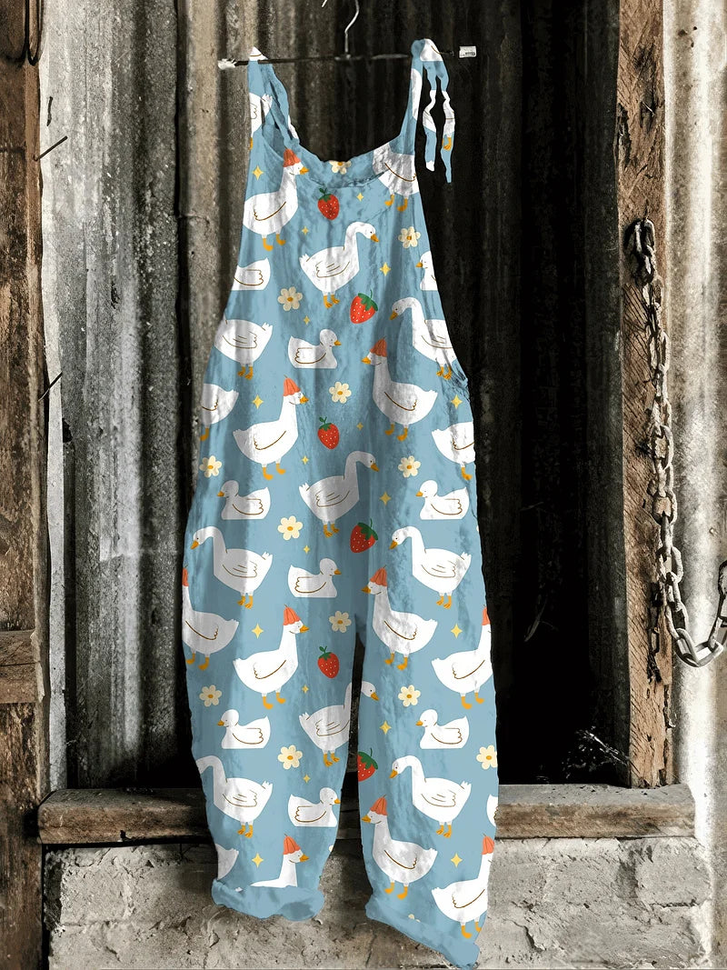 Lightweight artisanal jumpsuit in sky blue with goose & strawberry meadow print